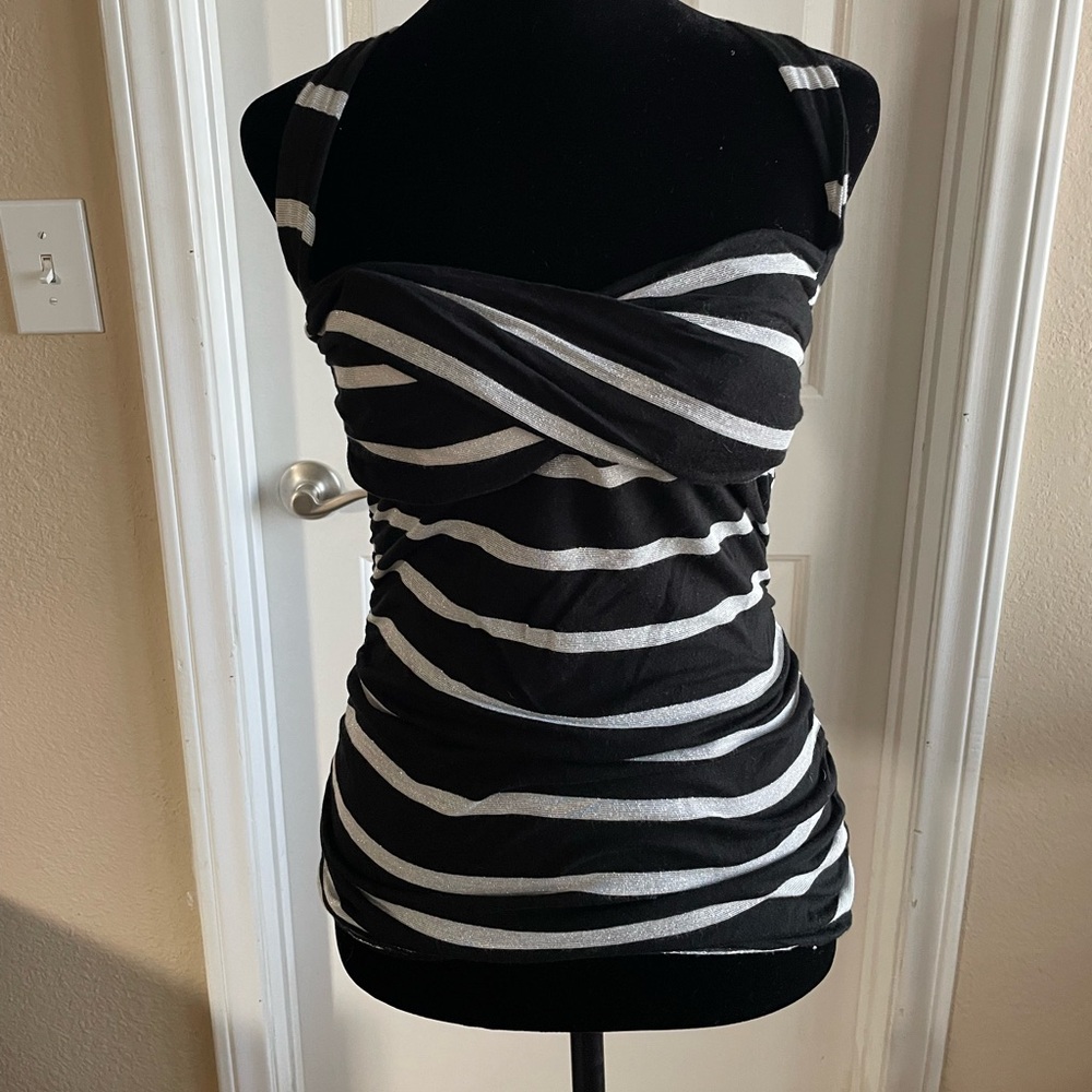 Pinup top , size small, tight fitting with bunching, crosses in back.